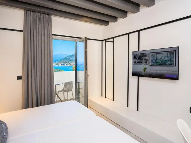 Bedroom corner with TV and sea view