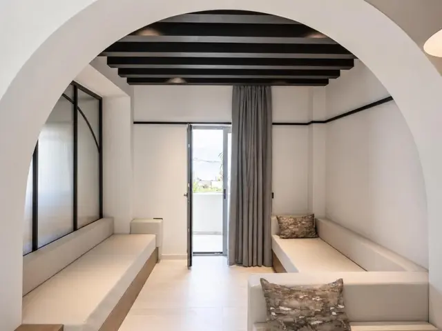 Living room with archway and sofa
