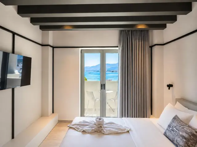 Twin beds with the sea outside the window