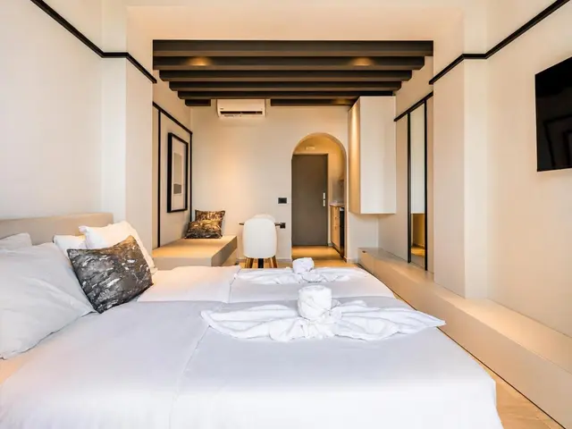 Deluxe studio beds under the wooden-beam ceiling